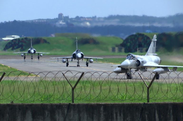 Taiwan Air Force Mirage fighter jets taxi on a runway at an airbase in Hsinchu, Taiwan