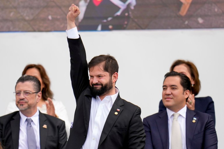 Chilean President Gabriel Boric waves during the swearing-in ceremony for Colombia's new President Gustavo Petro in Bogota, Colombia, Sunday.