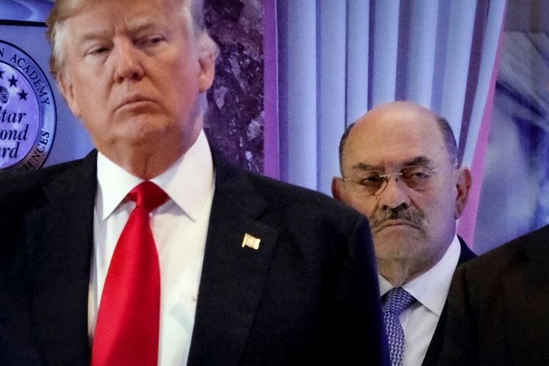 Allen Weisselberg, right, stands behind then President-elect Donald Trump