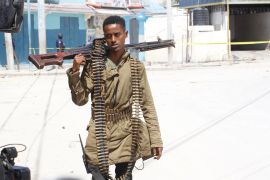 A soldier patrols outside the Hayat Hotel in Mogadishu, Somalia.