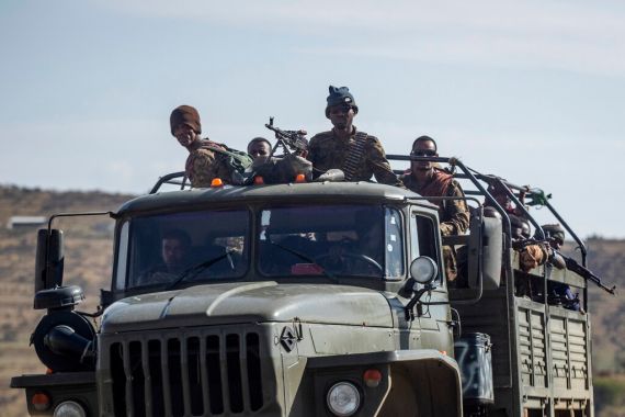 Ethiopian government soldiers ride in the back of a truck