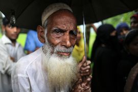 An elderly Rohingya refugee waits in the aid distribution line in Cox's Bazar, Bangladesh