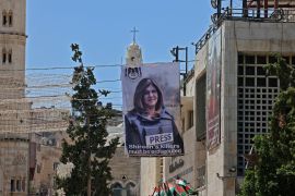 Banners depicting former Palestinian-American journalist Shireen Abu Akleh hang on a building overlooking the Church of the Nativity in Bethlehem in the occupied West Bank.