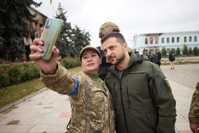 Ukraine's President Volodymyr Zelenskyy is seen visiting soldiers in territory recaptured from Russian forces