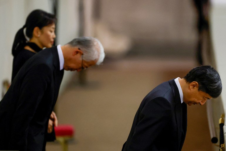 Japanese Emperor Naruhito bows deeply as he pays respects to Queen Elizabeth