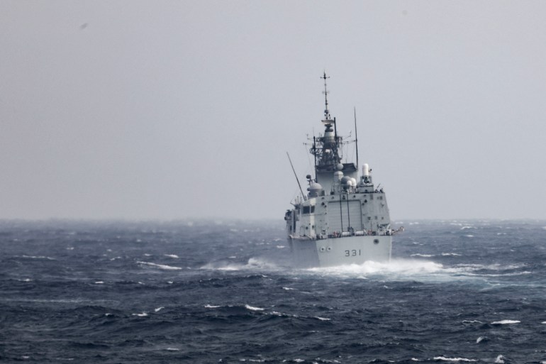 The Canadian navy frigate HMCS Vancouver travels through the choppy seas of the Taiwan Strait
