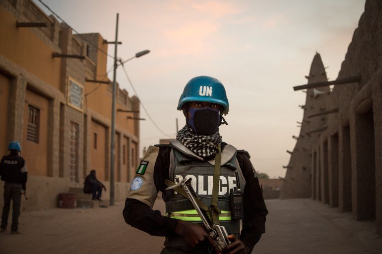Policemen of the MINUSMA patrol in front of the Great Mosque in Timbuktu, on December 8, 2021