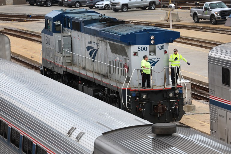 CHICAGO, ILLINOIS - SEPTEMBER 13: Workers service trains in the Amtrak Car Yard south of the Loop on September 13, 2022 in Chicago