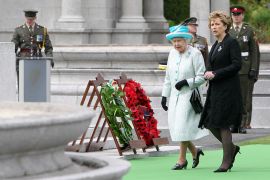 Britain's Queen Elizabeth, (left). walks with Ireland's President Mary McAleese, (right), after a wreath laying ceremony at the Irish War Memorial Garden in Dublin in 2011 [File: Maxwell's/Pool/Reuters]