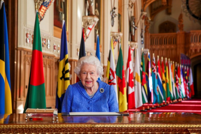 Britain's Queen Elizabeth II signs her annual Commonwealth Day message in St George's Hall at Windsor Castle, Britain, in this picture issued March 5, 2021.