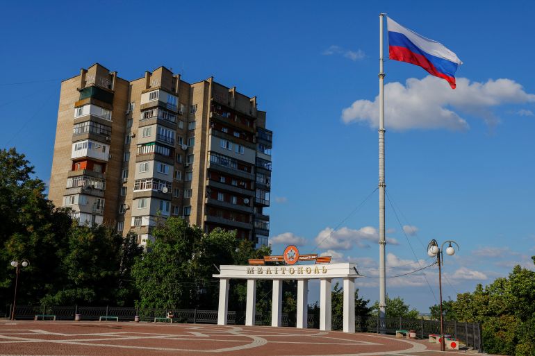 A flag flies in a square in the course of Ukraine-Russia conflict in the Russian-controlled city of Melitopol in the Zaporizhzhia region, Ukraine August 3, 2022.
