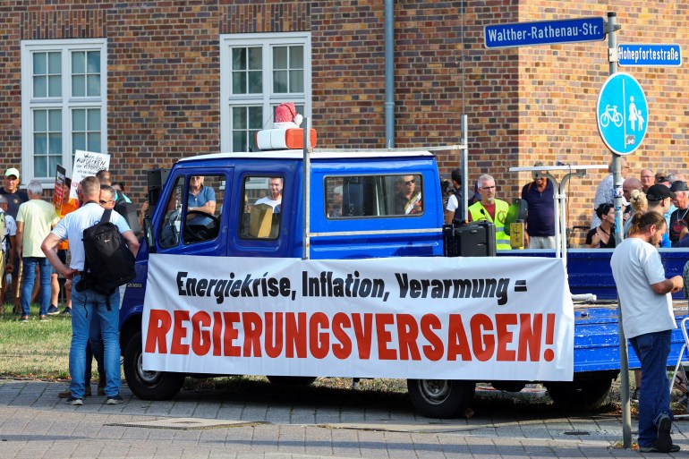 A banner reading "energy crisis, inflation, impoverishment = government failure" is put on a vehicle in Magdeburg, Germany.