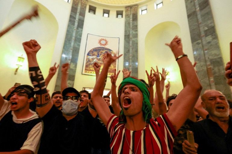 Supporters of Iraqi populist leader Moqtada al-Sadr protest at the Green Zone, in Baghdad, Iraq August 29, 2022.