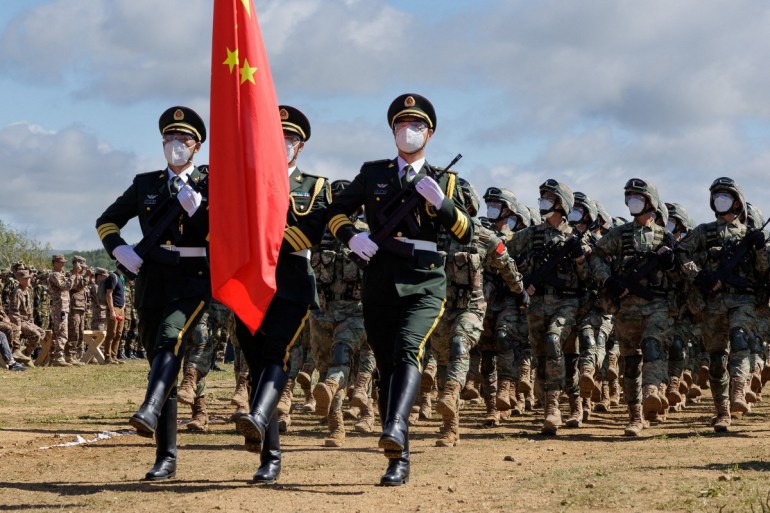 Chinese service members take part in a ceremony opening Vostok 2022 military exercises at a firing ground in the far eastern Primorsky region, Russia, August 31, 2022. Russian Defence Ministry/Handout via REUTERS ATTENTION EDITORS- THIS IMAGE HAS BEEN SUPPLIED BY A THIRD PARTY. NO RESALES. NO ARCHIVES. MANDATORY CREDIT