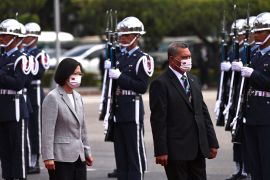 Taiwan President Tsai Ing-wen walks with Tuvalu Prime Minister Kausea Natano inspect troops at a welcoming ceremony in Taipei