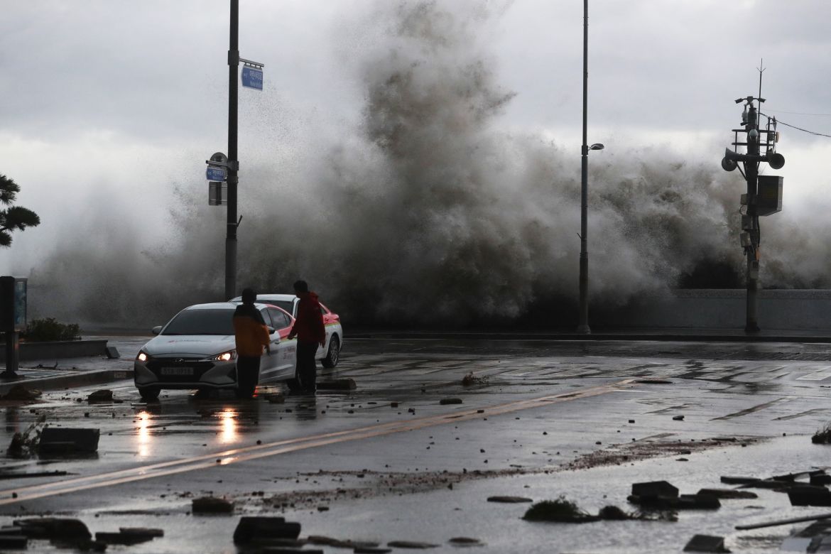 A wave caused by Typhoon Hinnamnor hits the waterfront in Busan