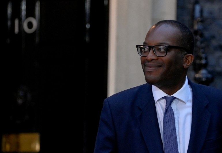 New British Chancellor of the Exchequer Kwasi Kwarteng walks outside Number 10 Downing Street