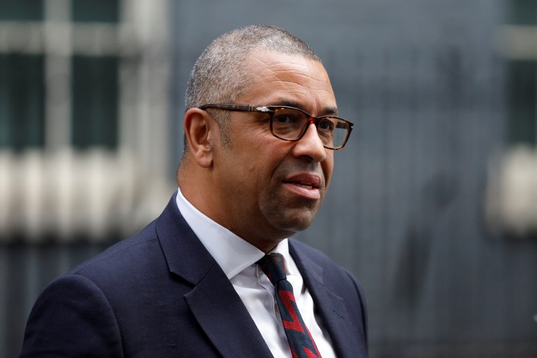 Foreign Secretary James Cleverly walks outside Cabinet building