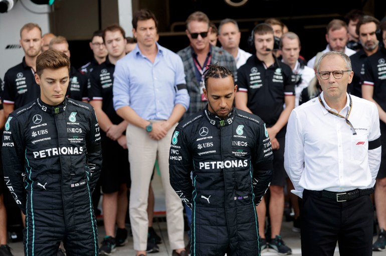 Lewis Hamilto, George Russell and CEO of Formula One Group, Stefano Domenicali