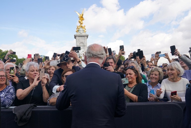 King Charles III is greeted by well-wishers during a walkabout to view tributes left outside Buckingham Palace, London, following the death of Queen Elizabeth II 