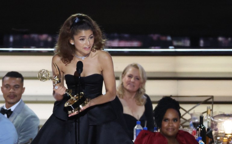 Zendaya, in a black gown, accepts the Emmy for best actress in a drama 