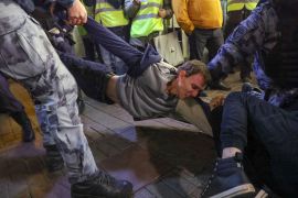 Russian police detain protester