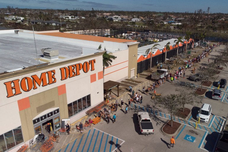 A line stretches outside a Home Depot store in Florida after Hurricane Ian