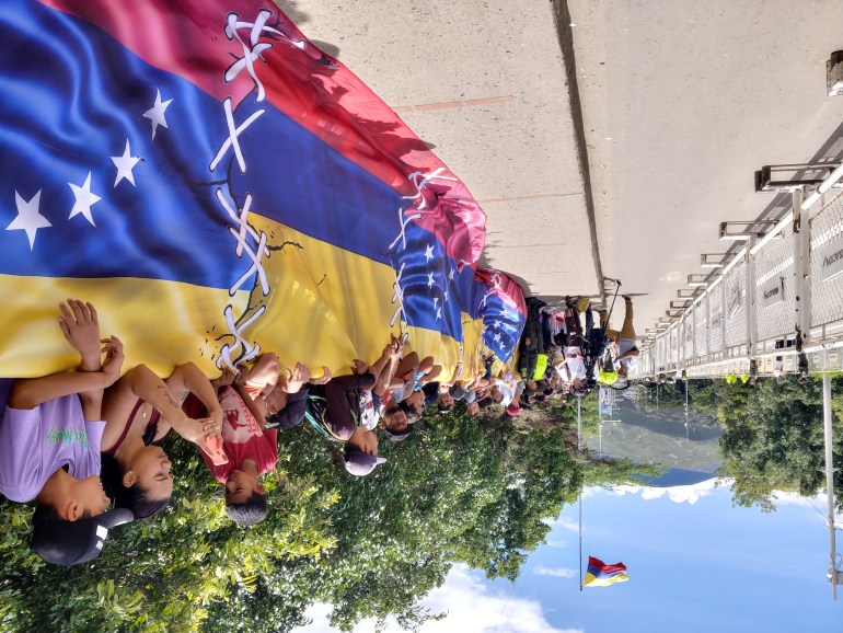 People line Simon Bolivar Bridge between Colombia and Venezuela during a reopening ceremony