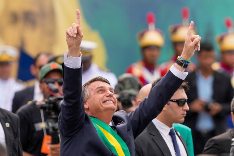 Brazil's President Jair Bolsonaro points up during a military parade to celebrate the bicentennial of the country's independence from Portugal, in Brasília, Brazil, Wednesday, Sept. 7, 2022. [Eraldo PeresAP Photo]
