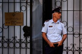 A policeman stands guard outside the Iranian Embassy in Tirana.