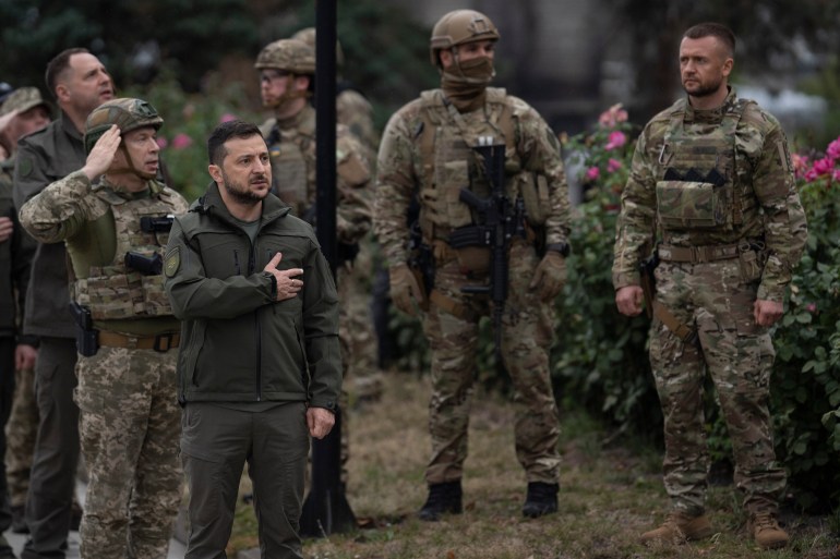 Ukraine's President Volodymyr Zelenskyy is seen visiting soldiers in territory recaptured from Russian forces
