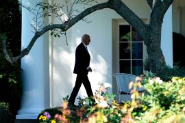 US president Joe Biden walking outside the White House