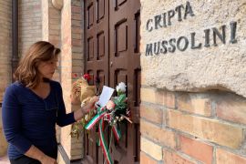 Journalist Barbara Serra, outside Benito Mussolini's crypt in Predappio, Italy, in 2019