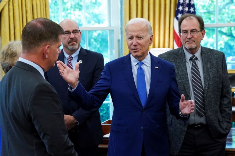 U.S. President Joe Biden greets negotiators who brokered the railway labor agreement after U.S. railroads and unions secured a tentative deal to avert a rail shutdown, in the Oval Office at the White House in Washington, US,