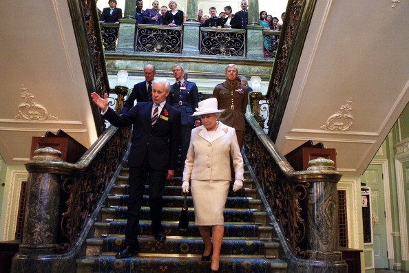 Queen Elizabeth II with Admiral Sir Ian Garnett at the Royal College Of Defence Studies in 2007
