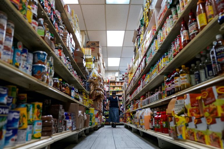 A woman shops for groceries at El Progreso Market in the Mount Pleasant neighborhood of Washington, D.C., U.S.