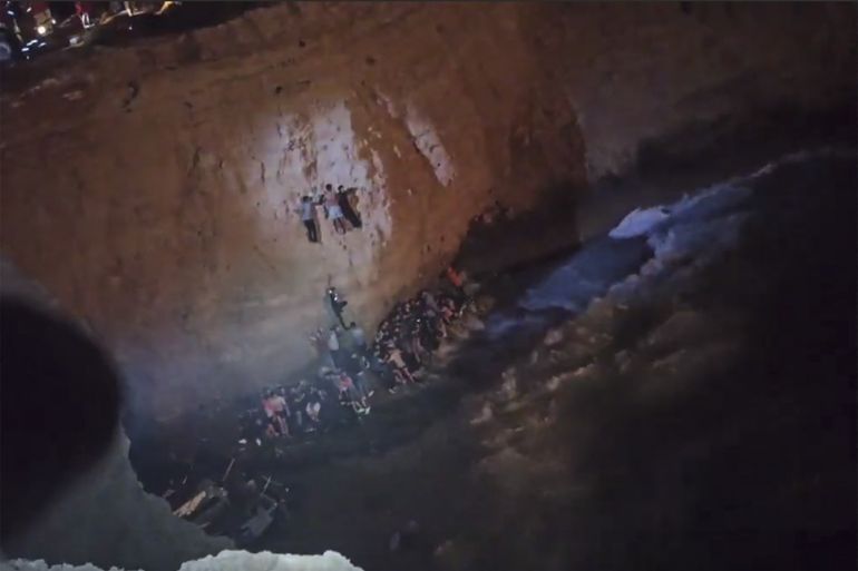This screen grab from a video made available by the Hellenic Coast Guard shows the rescue of migrants from a shipwreck off the island of Kythira, south of the Peloponnese peninsula.