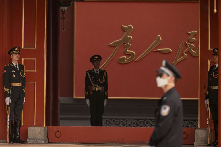 Security personnel stand guard at Zhongnanhai near Tiananmen Square