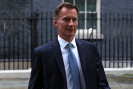 Britain's new Chancellor of the Exchequer Jeremy Hunt leaves 10 Downing Street in central London.