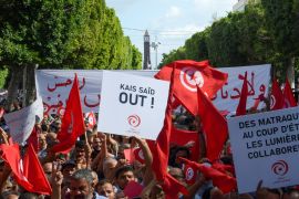 Ennahdha party supporters wave the Tunisian flag during a demonstration against Pesident Kais Saied in Tunis on October 15, 2022. [File: Fethi Belaid/AFP]