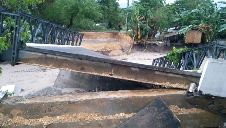 A destroyed bridge in the village of Cusiong, Datu Odin Sinsuat, in the southern Philippines, on October 28, 2022 due to heavy rains [Jovilyn Sapi Lumutos/AFP]