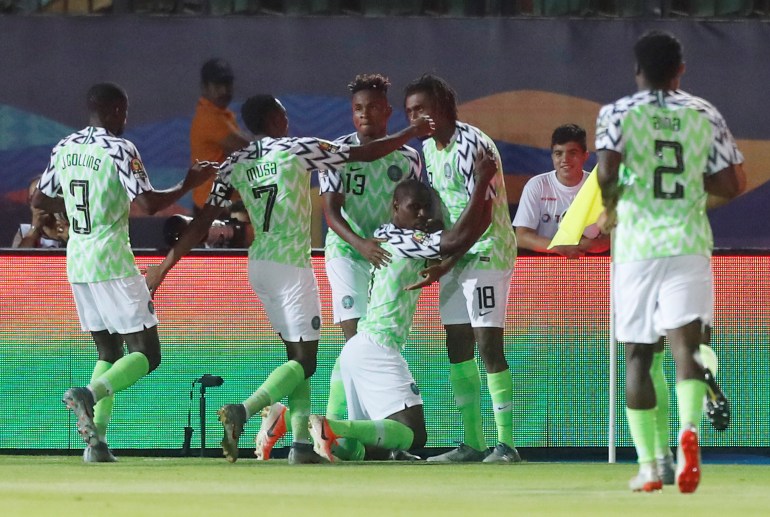 Nigeria's Odion Ighalo celebrates scoring their first goal with team mates 