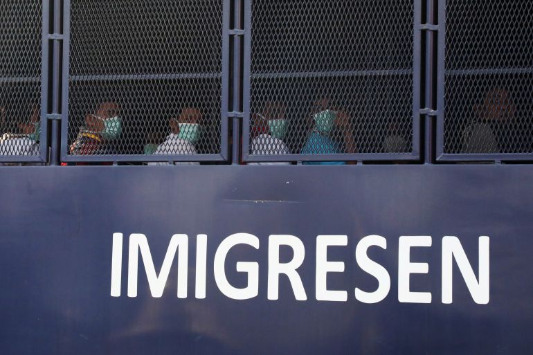 Myanmar migrants are seen inside an immigration truck, in Lumut, Malaysia in February 2021 [File: Lim Huey Teng/Reuters]