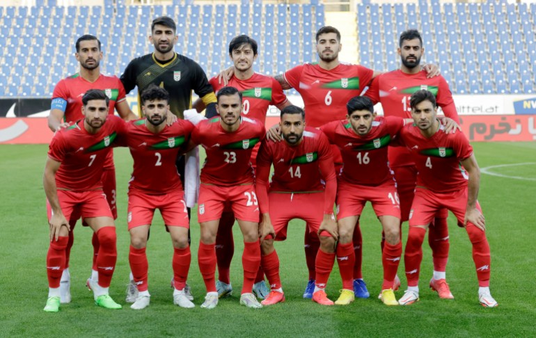 Iranian players pose for a team group photo before a match