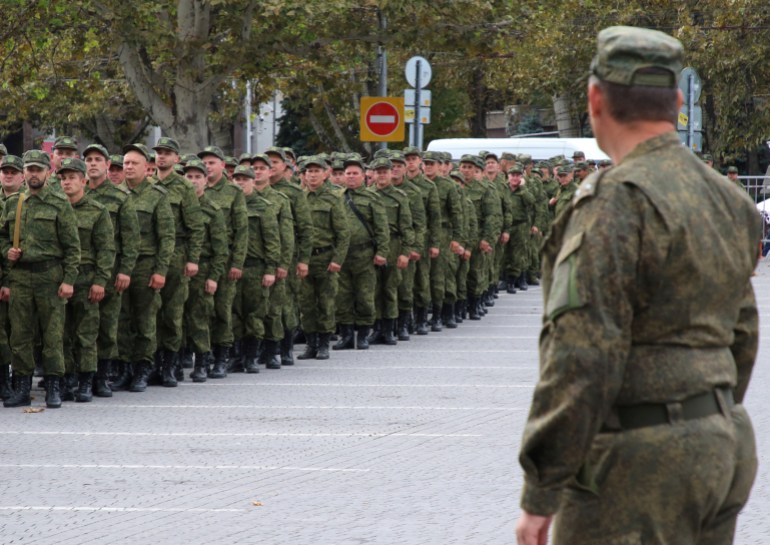 Reservists drafted during the partial mobilisation attend a ceremony before departure for military bases, in Sevastopol, Crimea September 27, 2022.