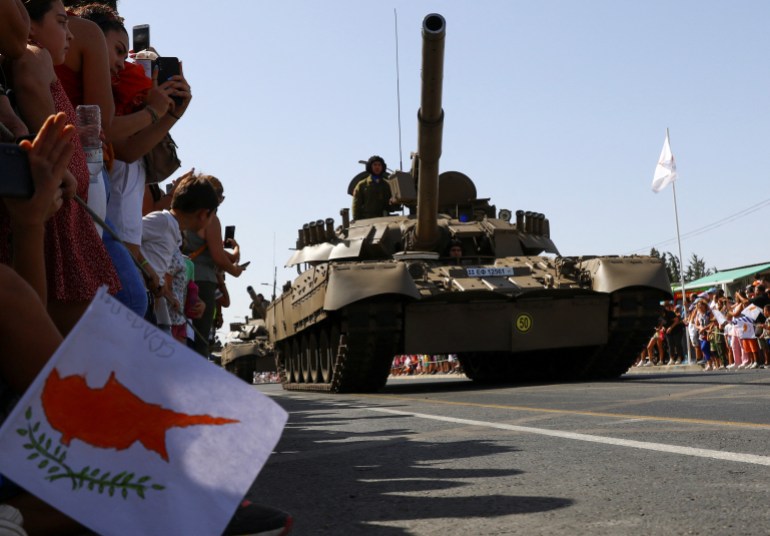 Cypriot army armoured vehicles participate in a military parade marking Cyprus' Independence Day in Nicosia, Cyprus
