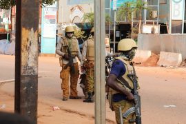 New junta's soldiers stand guard in a street of Ouagadougou, Burkina Faso