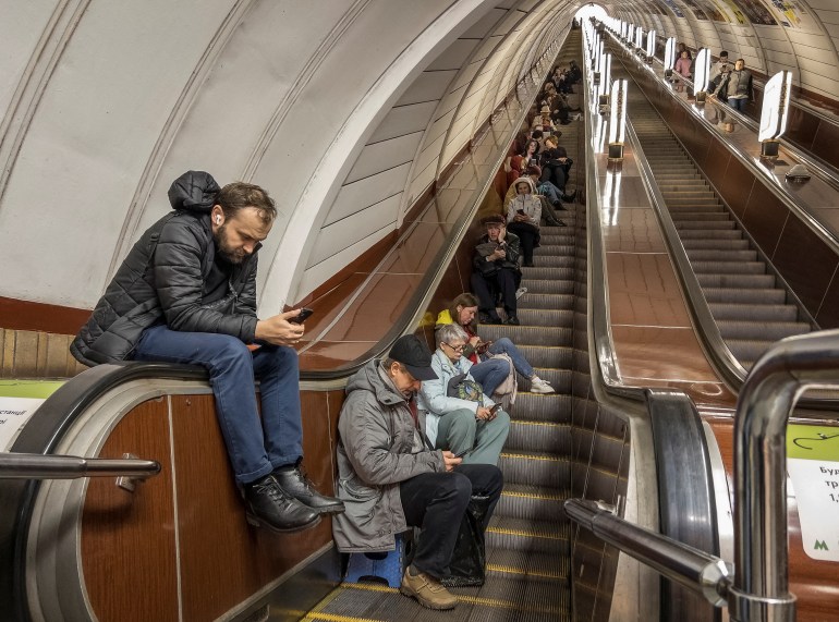 People shelter inside a subway station during a Russian missile attack, as Russia's attack on Ukraine continues, in Kyiv, Ukraine October 25, 2022. REUTERS/Vladyslav Musiienko