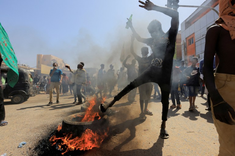 Protesters march during a rally against military rule following the last coup, in Khartoum, Sudan, October 25, 2022