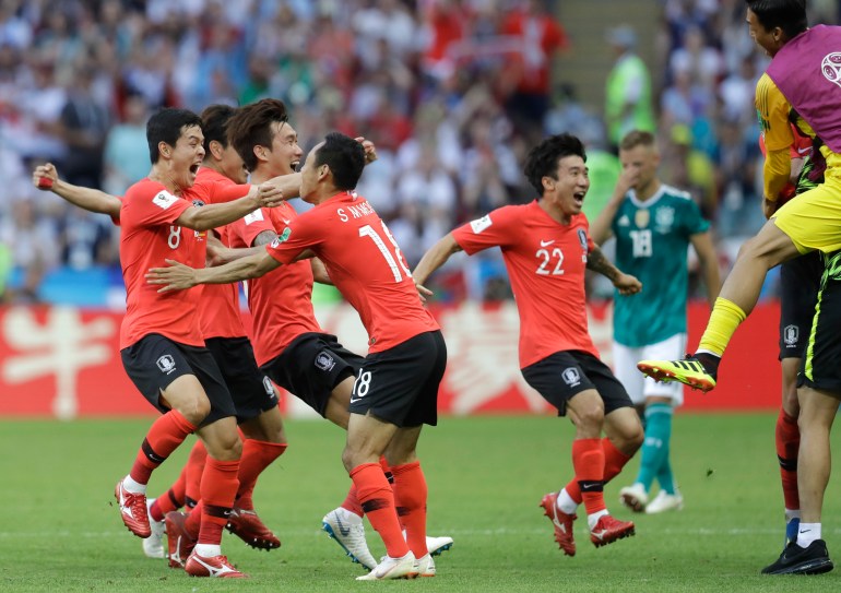South Korean players celebrate after referee Mark Geiger from the US decided on goal